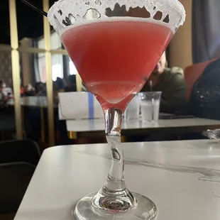a close up of a drink in a martini glass