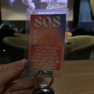 SOS sign for the table when you need service during a movie!