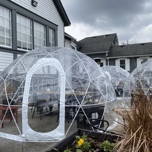 Outdoor tables in a bubble