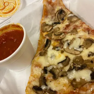 Mushroom pizza and a side of sauce