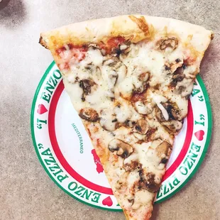 Slice of mushroom pizza.
