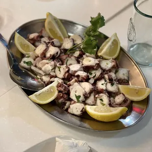 octopus with lemon wedges