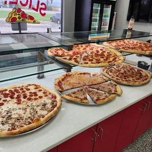 BY THE SLICE PIZZA! Pepperoni, mushroom, sausage, cheese,pepperoni sausage green olive and cupped pepperoni too!