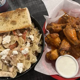 Wings and customized pasta bowl