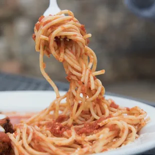 a plate of spaghetti with meatballs