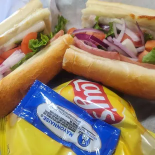 two hot dogs and a bag of chips
