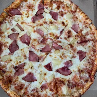 Hawaiian pizza pineapple and ham with a drizzle of honey