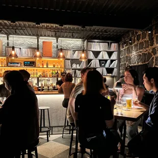 a group of people sitting at a bar