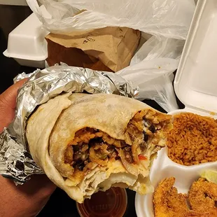 Cross section of a Cajun Steak Burrito. This place is Legit...