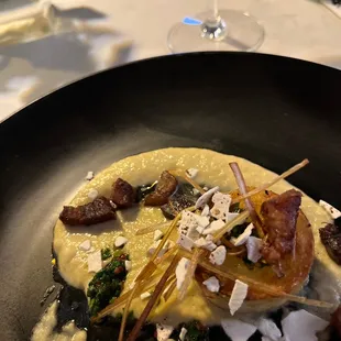 Potato &quot;scallop&quot; with leek soubise and lardons