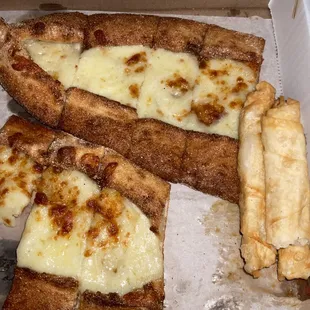 The left: pide with cheese. Right: cigarette borek.