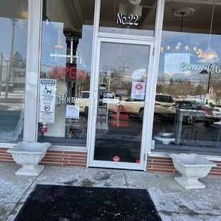 the entrance to a coffee shop