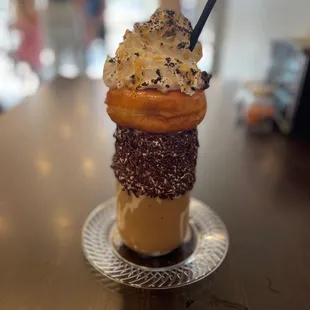 an ice cream cone with chocolate and sprinkles