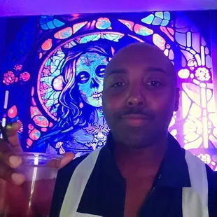 a man holding a drink