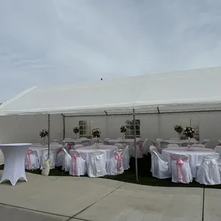Rented canopy, cocktail tables, round tables and chairs.