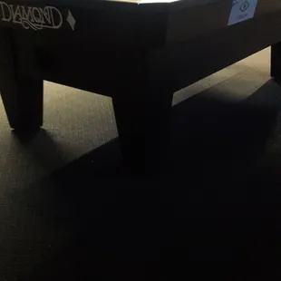 a pool table with a diamond logo on it