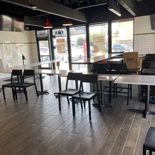 empty tables and chairs in a restaurant