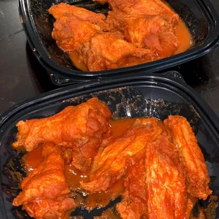 two trays of chicken wings