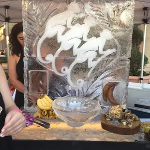 Monkey bourbon poured through the ice sculpture