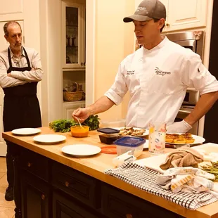Chef Mathew teaching plating technique at an in home lesson/4 course dinner.