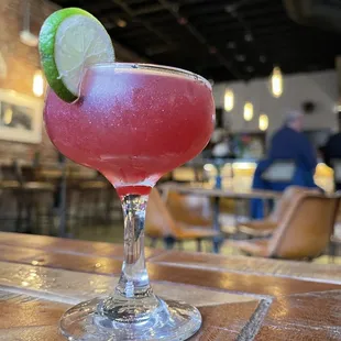 a drink in a glass on a table
