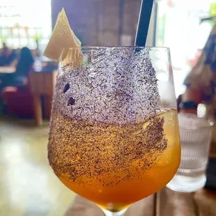 a drink in a glass on a table