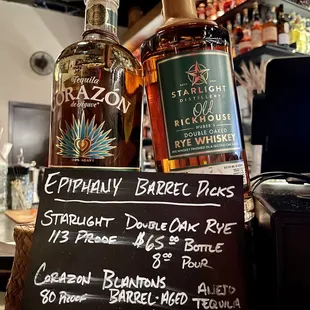 two bottles of alcohol on a bar counter