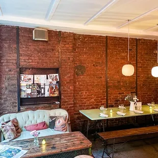 a living room with brick walls