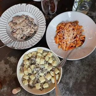 gnocchi (bottom) bolognese (right) and mushroom Orecchiette (left)
