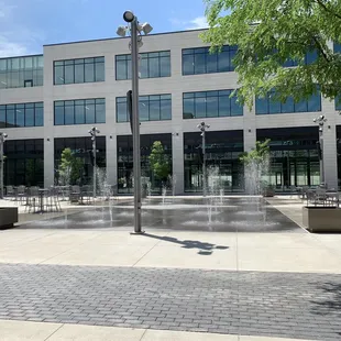a fountain in front of a building