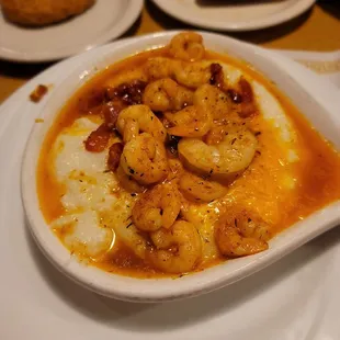 Shrimp/cheese grits, salmon patty, smoked sausage.  Salmon was excellent, grits were cold, bland and gross