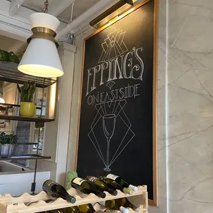 a wine rack and chalkboard