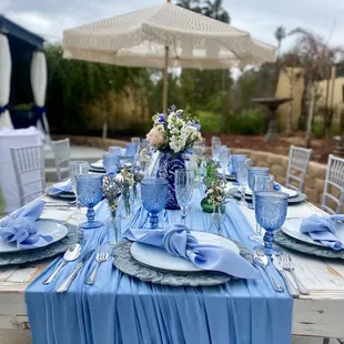 Dusty blue decor on our white napa table