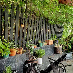 a row of chairs and tables on a patio