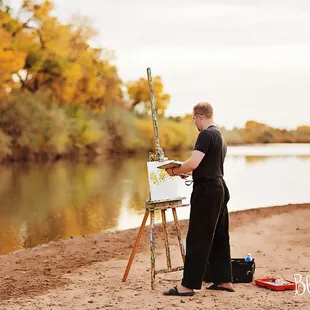 Dr. Michael Pridham painting by the river