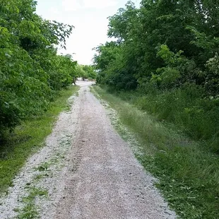Flint Hills Nature Trail!  117 total miles of abandoned railbed, in varrying degrees of rehab. I get to ride my horse to work on this!!