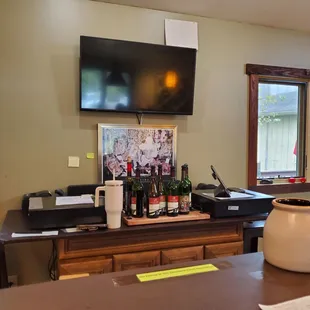a bar with a television on the wall