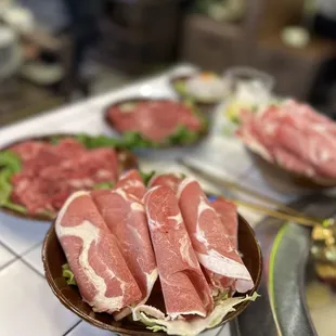 a variety of meats on a table