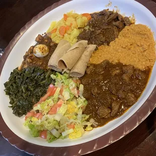 Lamb, beef and chicken with misor, gomen cabbage and salad.