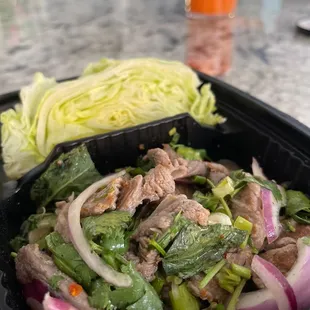 a salad in a plastic container