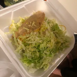 Hidden tacos under mountains of soggy lettuce