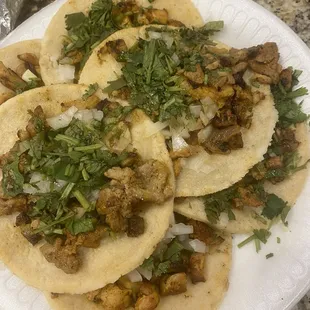Pollo and Al pastor tacos