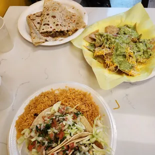 Guacamole and chips, fish taco plate, Erica's quesadilla