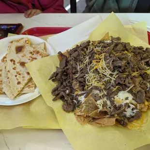 Best nachos in the springs. Barely see any chips because of the large amount of beef on top.