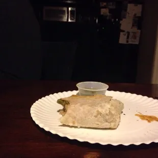 This is the burrito compared to the salsa container!! (This is half of the burrito only 1 or 2 bites in)