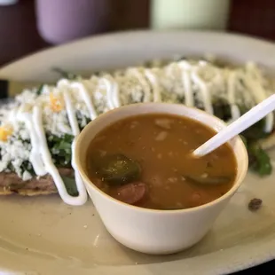 Huarache de asada  hotdog in borracho beans