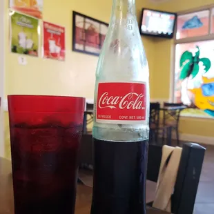 Mexican Coke with cup of ice.