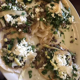 Bistec tacos with cheese added