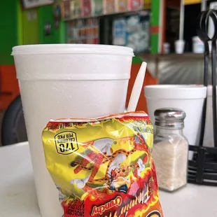 a bag of chips and a cup of coffee