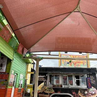 a food truck parked in front of a restaurant